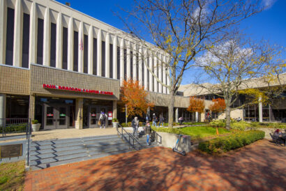 Original Caption:  Students walk and from Robeson Campus center on the Newark campus on a clear fall day