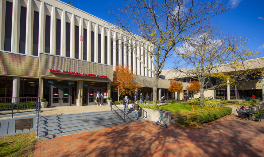 Original Caption:  Students walk and from Robeson Campus center on the Newark campus on a clear fall day